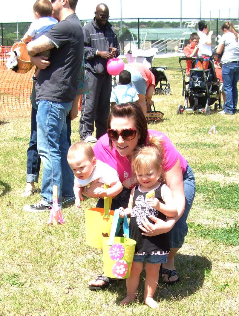 photo of kids and parents hunting for eggs